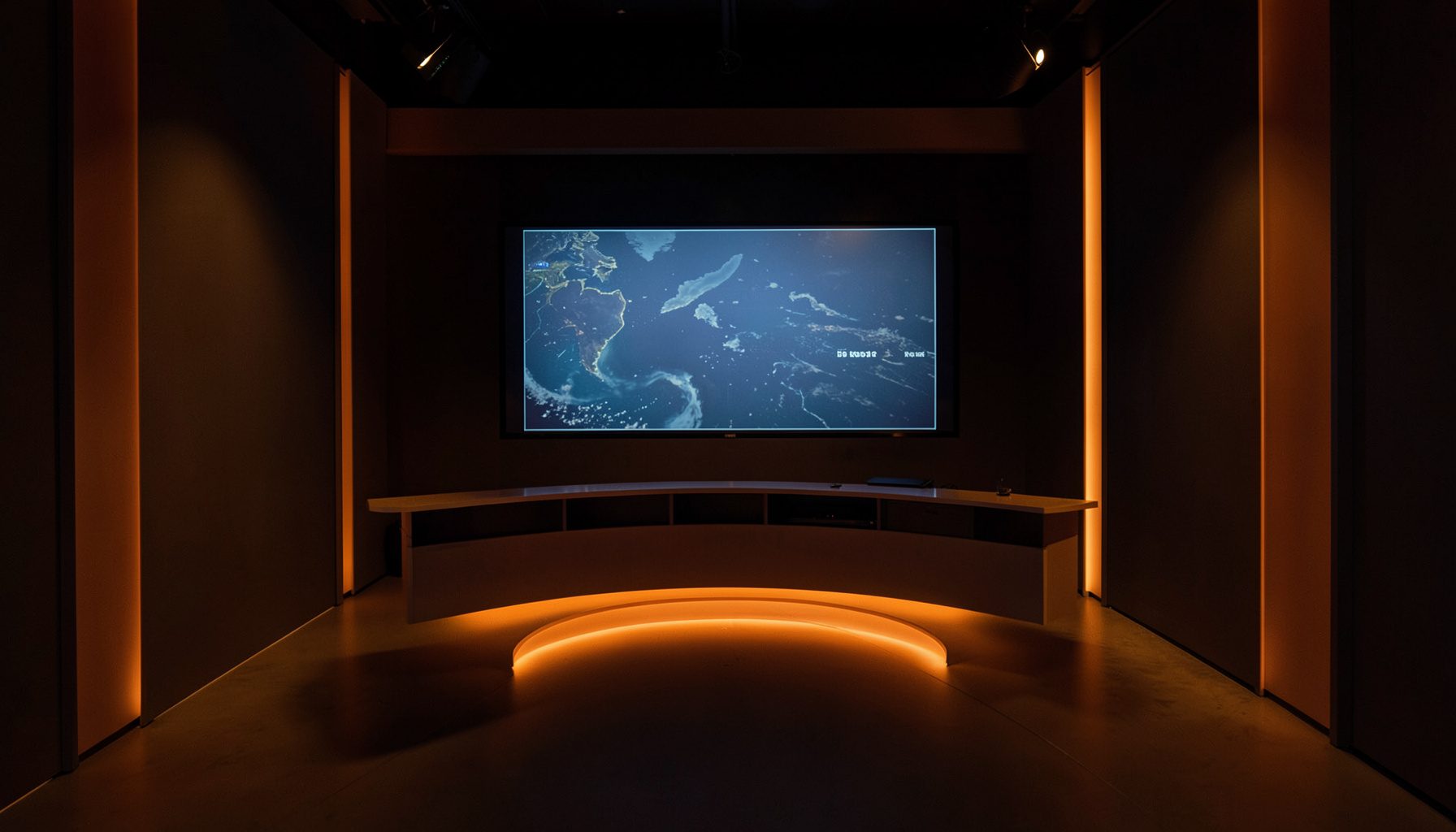 A broadcast studio interior with soft amber lighting, a curved desk, and a large weather display screen glowing with muted blue tones against dark walls.